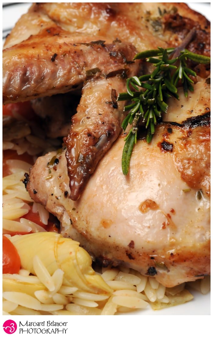 Close-up of rosemary chicken with orzo