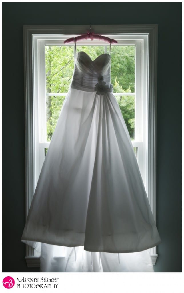 Wedding dress hanging in the window