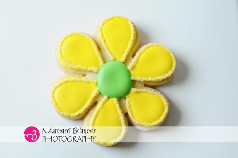 Yellow flower cookie made by Iced, A Cookie Company