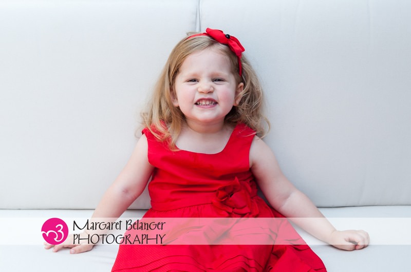 Little girl in a red dress on a white couch, Boston area family session