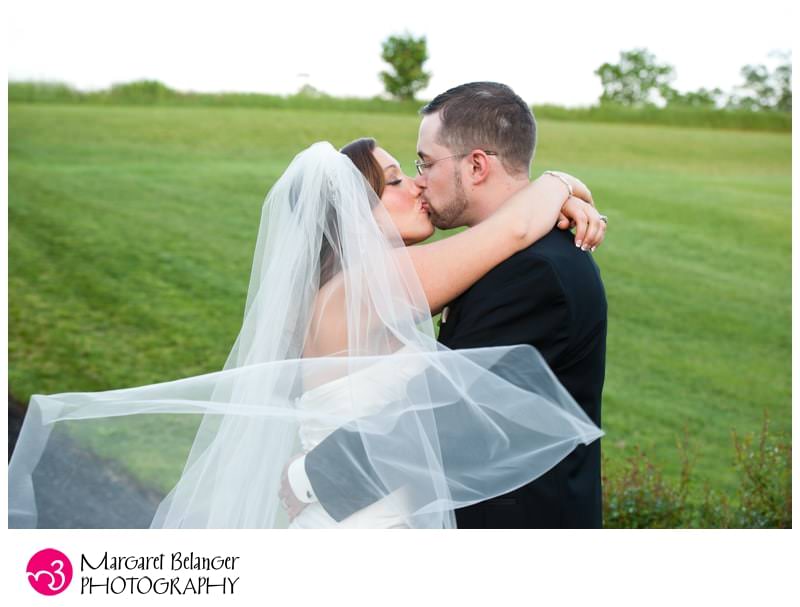 Portrait of bride and groom with bride's veil, Atkinson Resort and Country Club