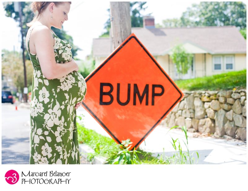 Arlington, MA pregnant woman near "bump" construction sign