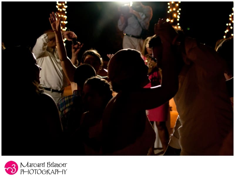Bride and groom backlit, dancing at Renaissance Island wedding reception, Aruba