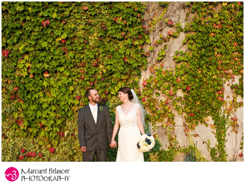 Bride and groom against the vines, Indian Pond Country Club