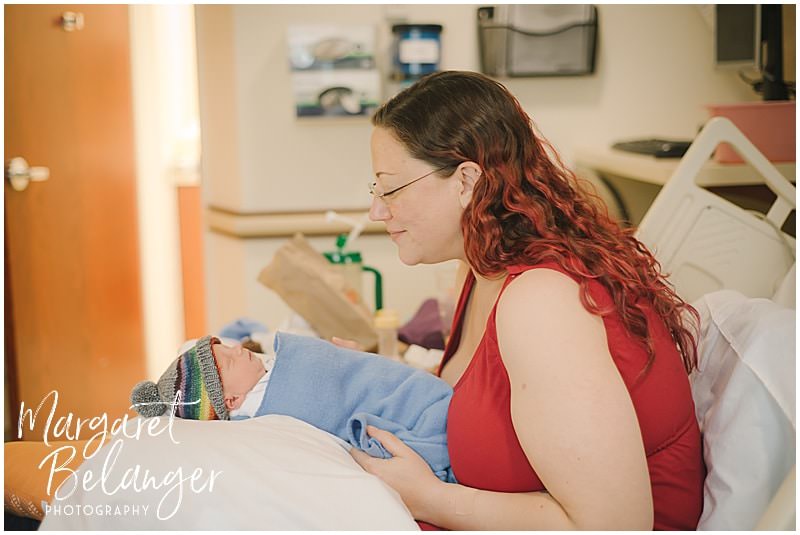 Fresh 48 newborn session at Emerson hospital, mom gazing at new baby