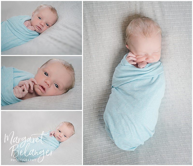 Lowell newborn session, baby in blue swaddle on gray blanket