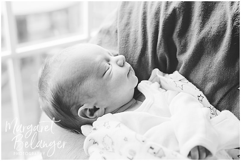 Lowell newborn session, baby in daddy's arms