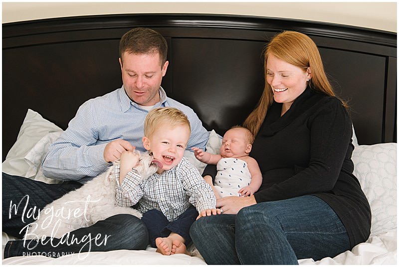 Winchester newborn session at home, family on bed with dog