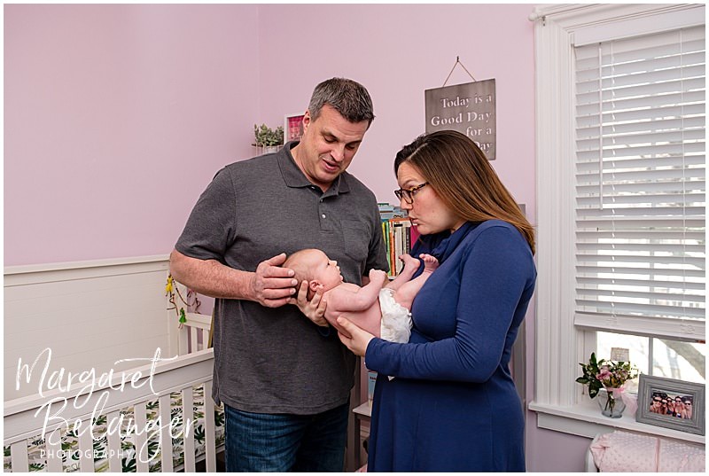 South Shore newborn session, baby with parents in pink nursery
