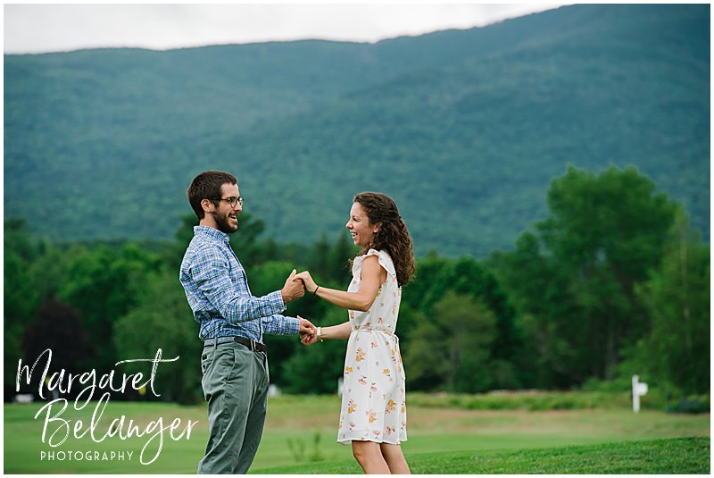 Couple dancing at the edge of the golf course at Waterville Valley