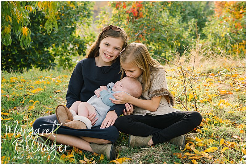 Boston Hill Farm Andover Family Session, two little girls holding their baby brother, one of them is kissing his head