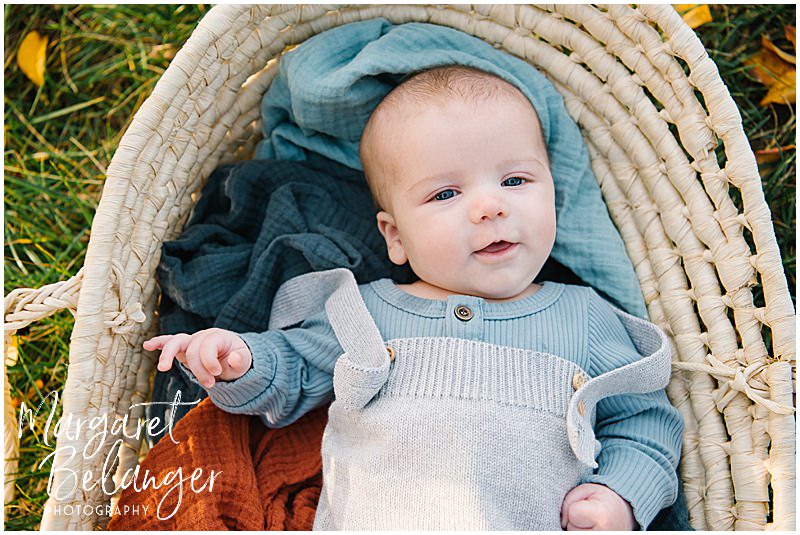 Baby boy in a moses basket, Boston Hill Farm family session