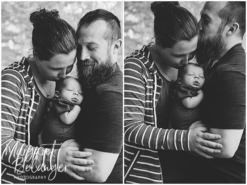 Black and white photos of newborn baby getting kisses from mom while dad holds him during their newborn photo session in Winchester, MA