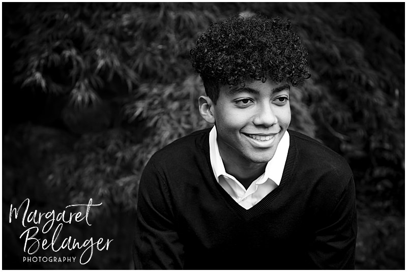 B&W photo of a boy smiling for his Winchester, MA senior portrait session