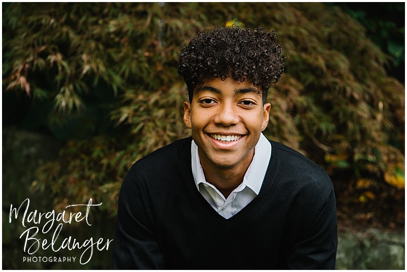 Photo of a boy smiling for his Winchester, MA senior portrait session