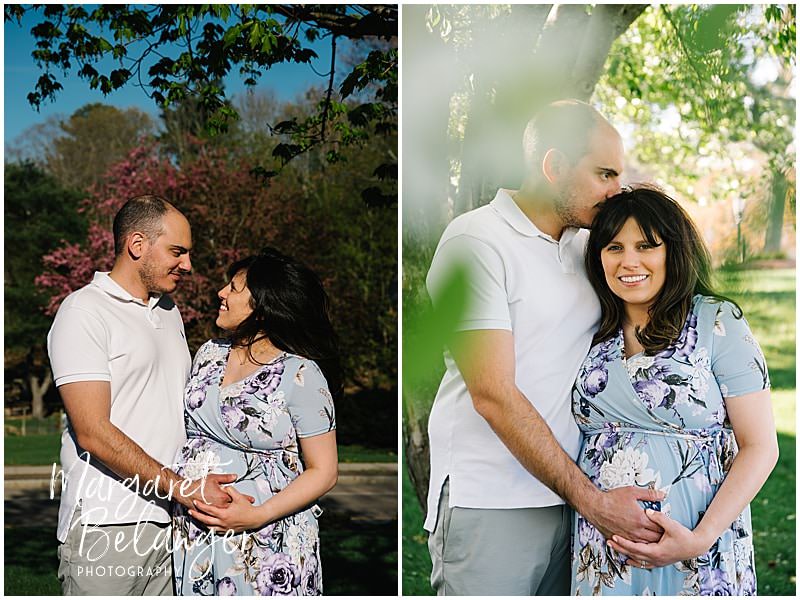 A couple posing for maternity photos during their maternity session in downtown Norfolk, MA