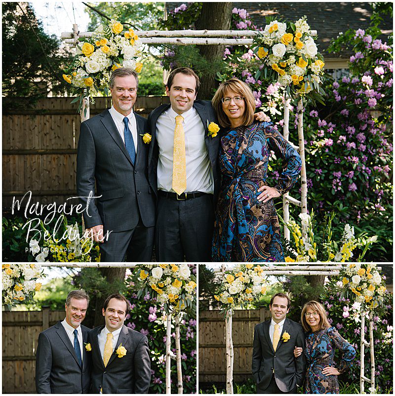 Family portrait of groom with groom's family during their Winchester, MA backyard wedding.