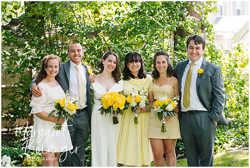A family portrait of the bride with her siblings during a Winchester, MA backyard wedding.
