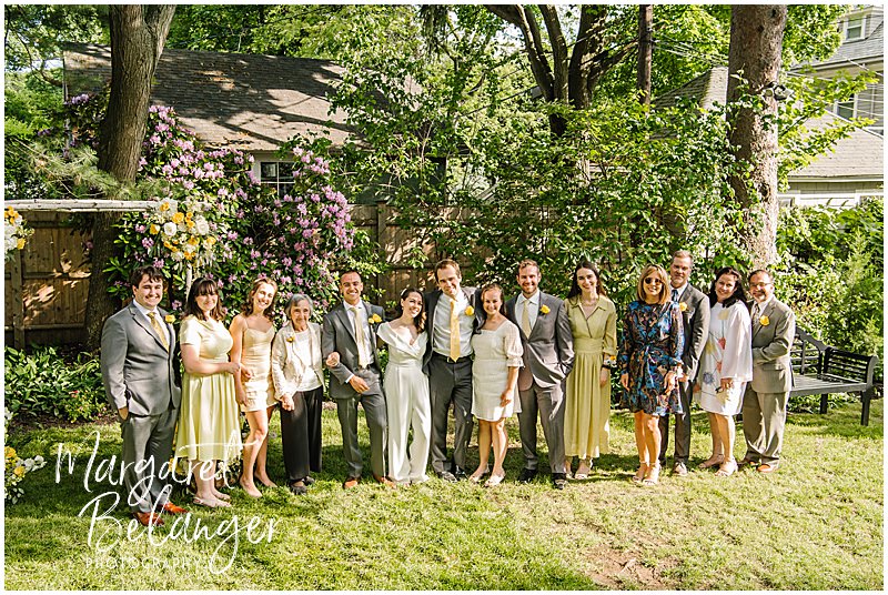 Family portrait at a backyard wedding in Winchester, MA.