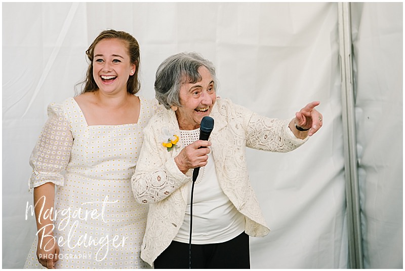 Bride's grandmother gives a toast during a Winchester, MA backyard wedding.