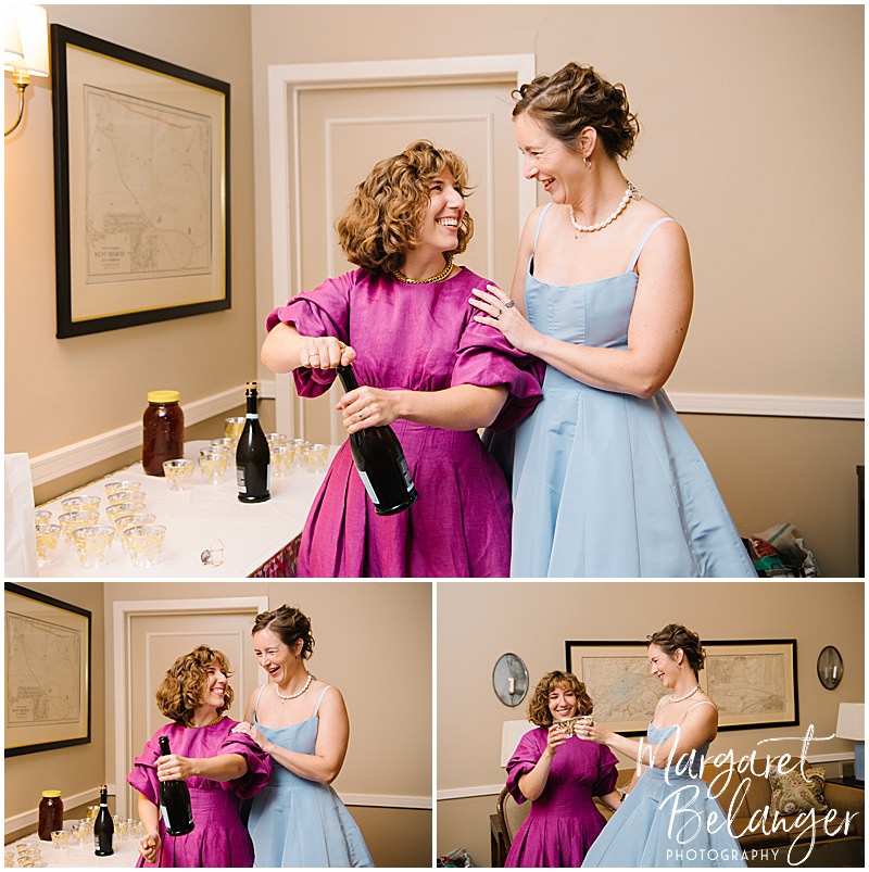 Brides pop champagne and toast before their same-sex wedding ceremony