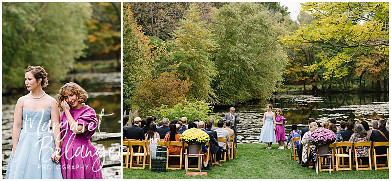 Two brides stand in front of a pond during their emotional same-sex wedding ceremony.