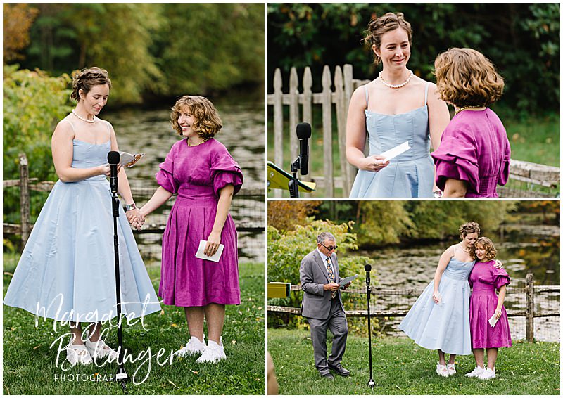 Two brides exchange vows in front of a pond during their same-sex wedding ceremony.