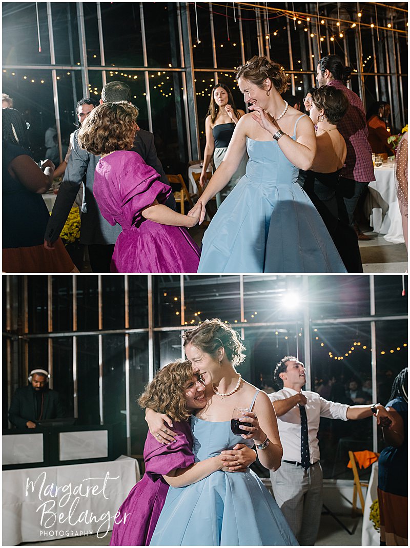 Brides dancing with their guests during their wedding reception.
